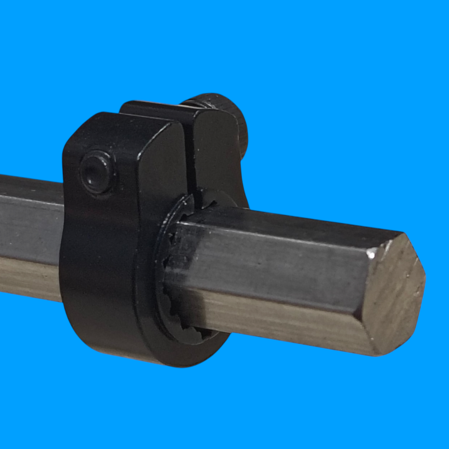 SWYFT Robotics black anodized aluminum clamping shaft collar secured on a 7mm hex shaft for FRC robotics.