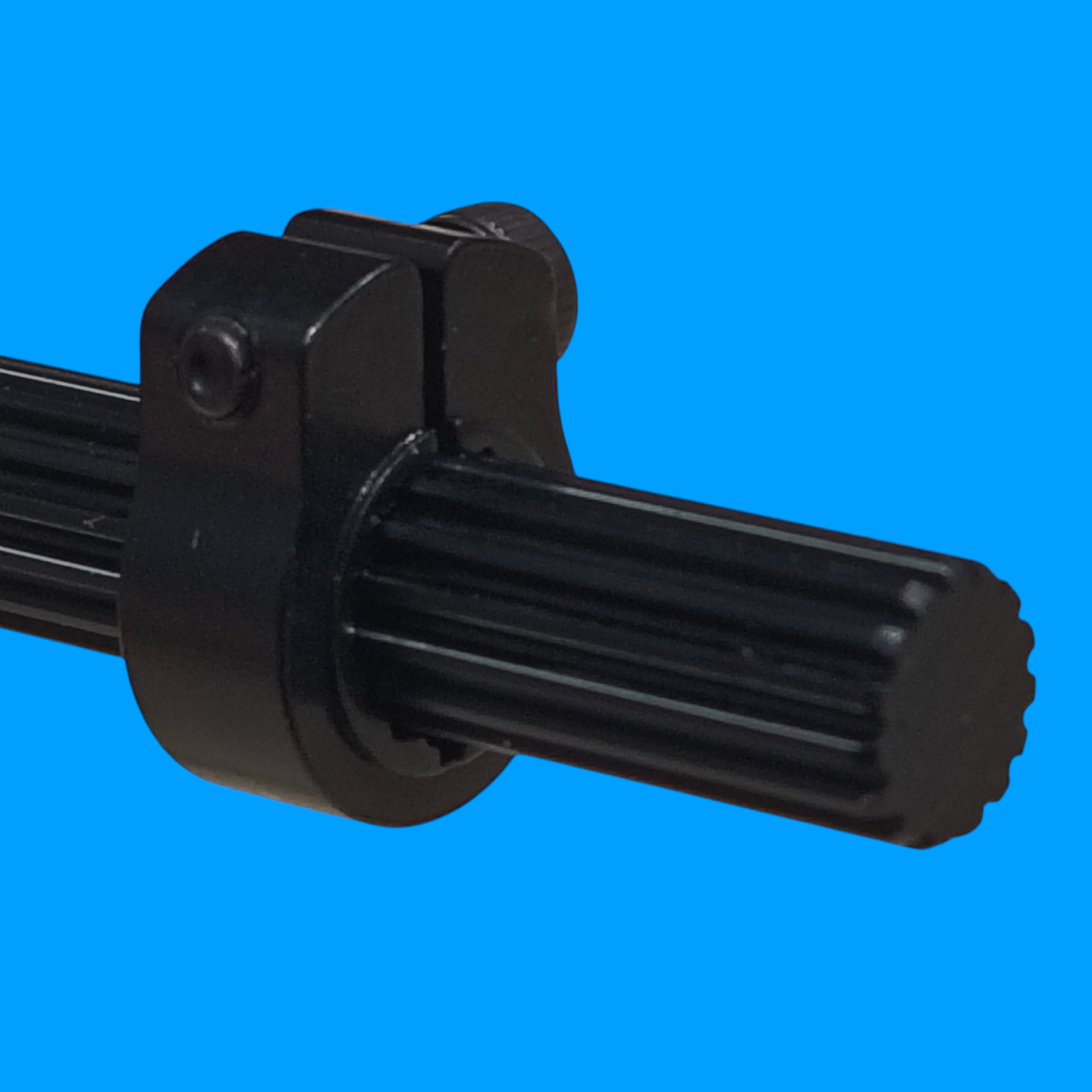 SWYFT Robotics black clamping shaft collar secured on a 15T SplineXS shaft for FRC robotics applications.